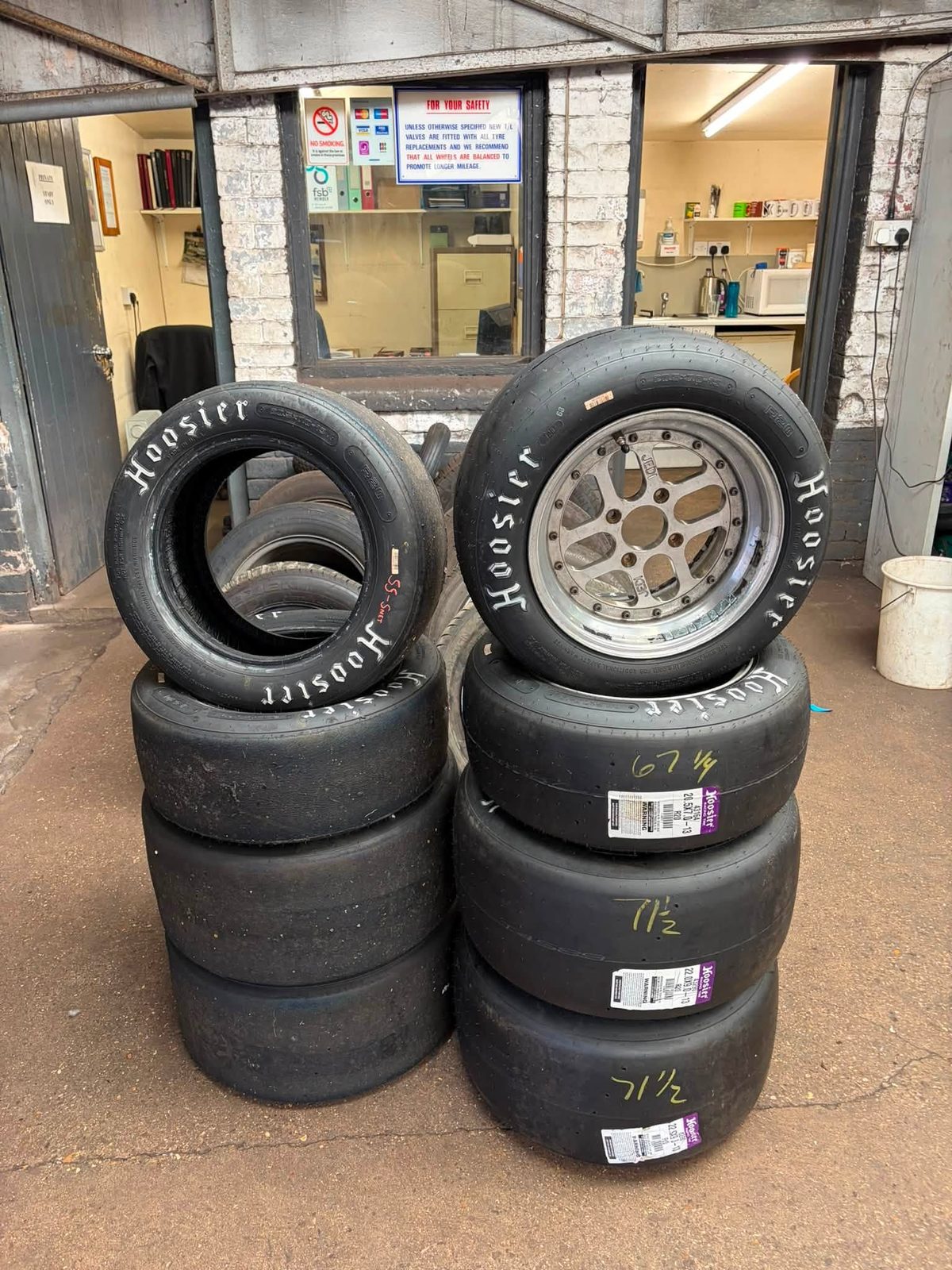 Stacks of Hoosier race tyres in the workshop